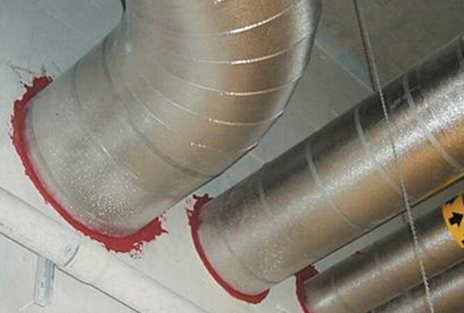 Sealed ductwork with metallic finish and red sealing compound in a building, installed by Insul-Techs Inc in Martinez.